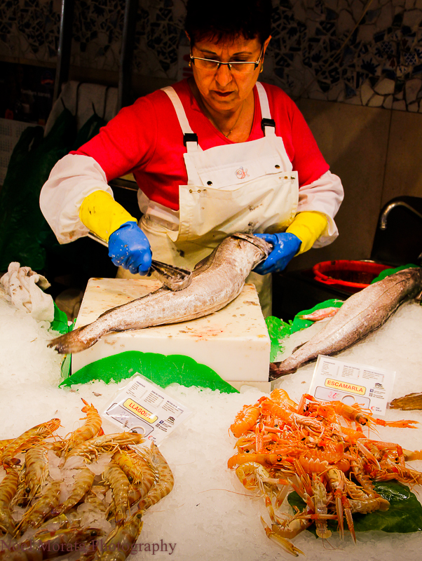 Fish vendor cleaning fish