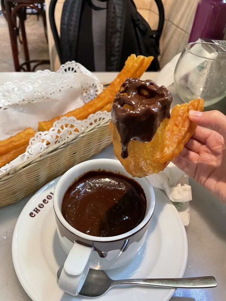 Churros with delicious chocolate for breakfast
