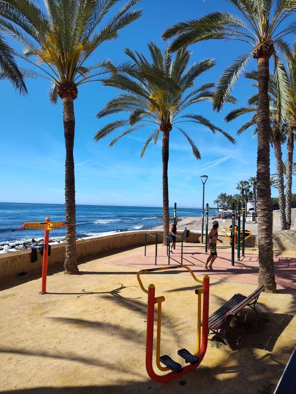 Walk along the boardwalk area of Marbella