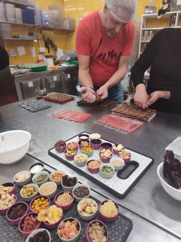 Checking out all the yummy toppings to add to our chocolate bars below